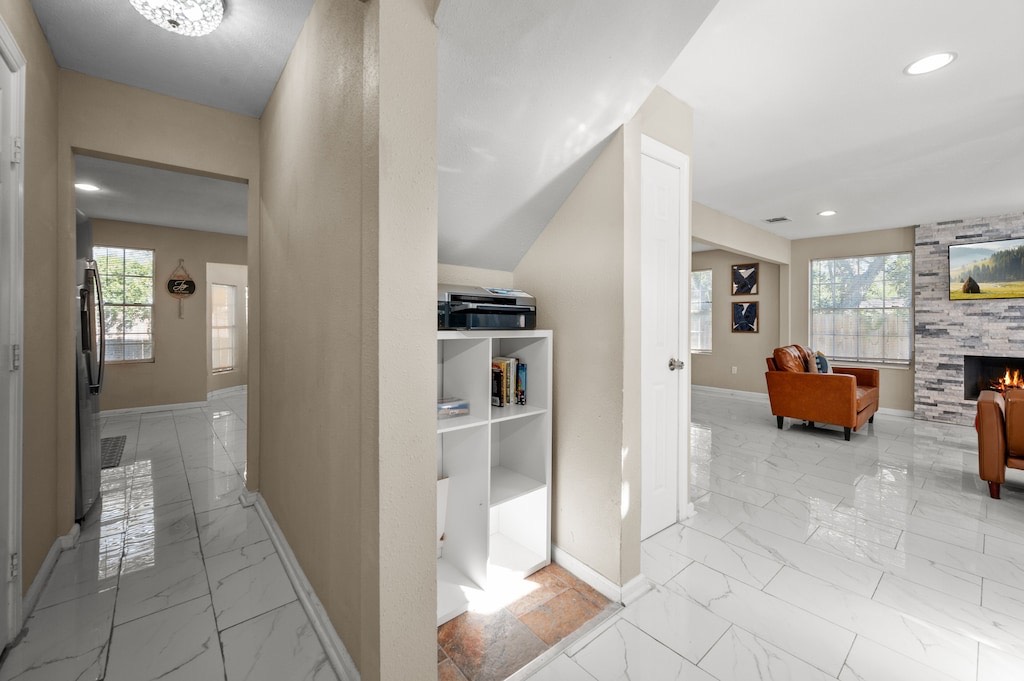 2504 Ferguson Way Houston, TX 77088 - Photo 10 of 32 a view of living room kitchen with furniture and a fireplace