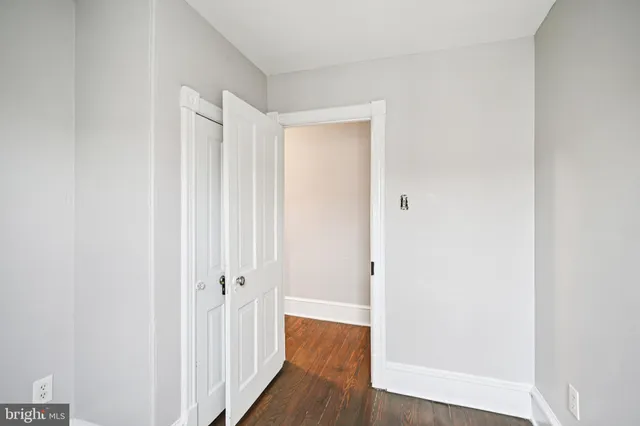 an aerial view of a residential houses with outdoor space and street view