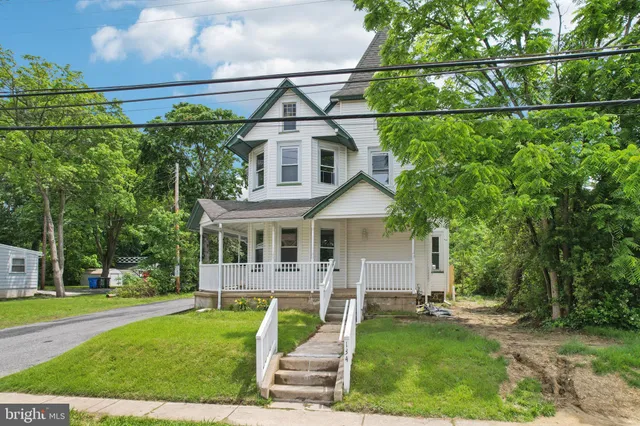 an aerial view of a house with a garden and plants