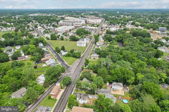 a front view of a house with iron fence