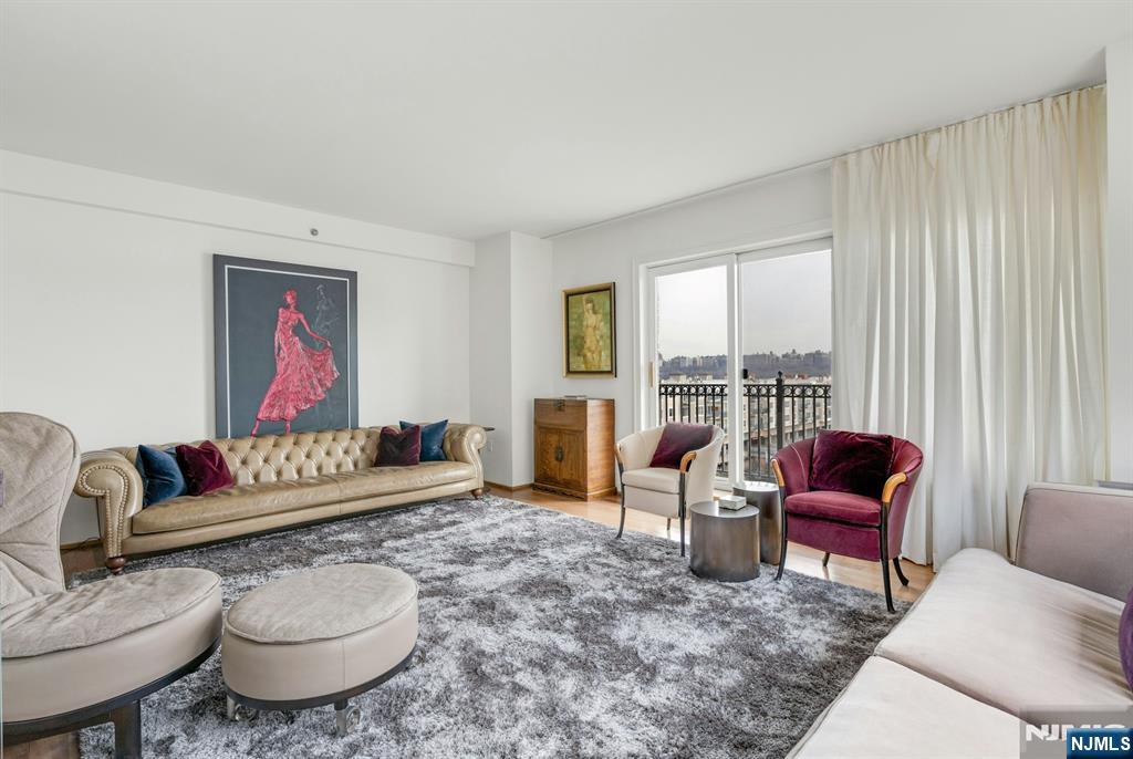 3219 City Place Edgewater, NJ 07020 - Photo 6 of 28 a living room with furniture and a floor to ceiling window