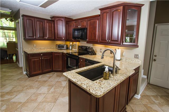 4155 Bethlehem Road Springfield, TN 37172 - Photo 6 of 19 This stunning kitchen has been completely remodeled. Brand new cherry cabinets with upper and lower cabinet lighting. Pull out drawers for pots and pans. Soft close drawers. Granite counter tops with a large granite composite sink. New tile floors.