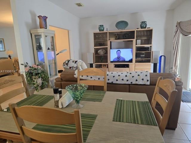 13016 Southwest 142nd Terrace Miami, FL 33186 - Photo 14 of 67 a living room with furniture and a flat screen tv