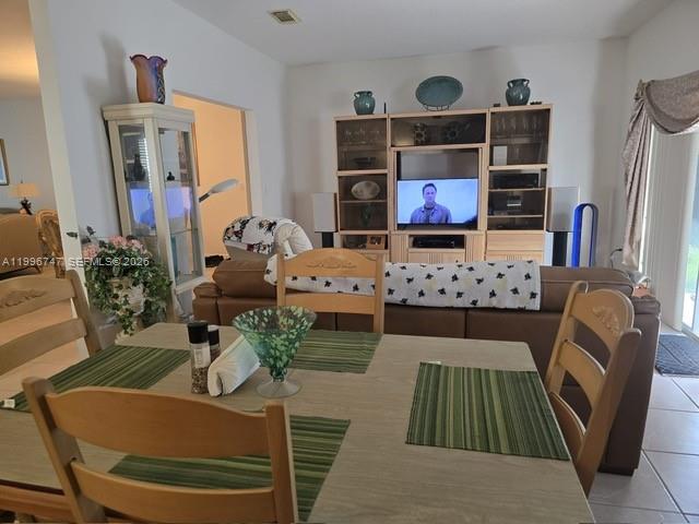 13016 Southwest 142nd Terrace Miami, FL 33186 - Photo 30 of 67 a living room with furniture and a flat screen tv