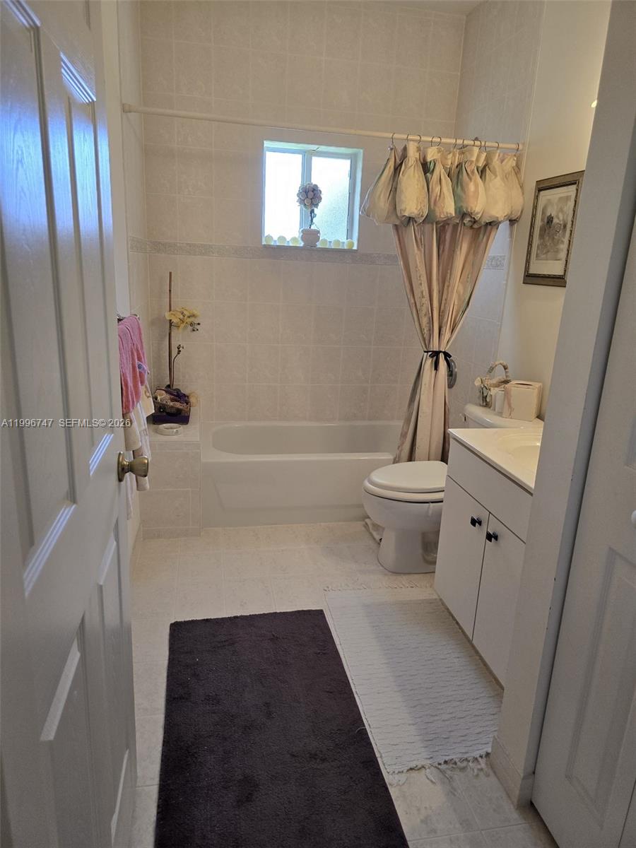 13016 Southwest 142nd Terrace Miami, FL 33186 - Photo 53 of 67 a bathroom with a sink toilet and shower