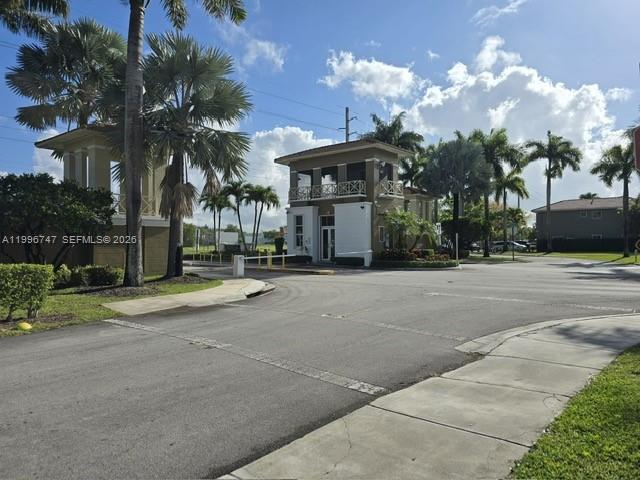 13016 Southwest 142nd Terrace Miami, FL 33186 - Photo 56 of 67 a row of palm trees in front of house