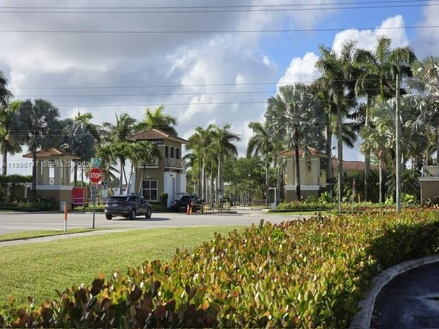 13016 Southwest 142nd Terrace Miami, FL 33186 - Photo 57 of 67 a building with trees in front of it