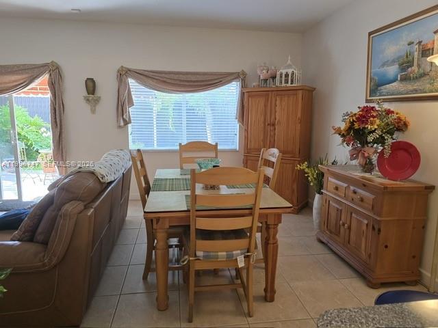 13016 Southwest 142nd Terrace Miami, FL 33186 - Photo 9 of 67 a view of a dining room with furniture window and outside view