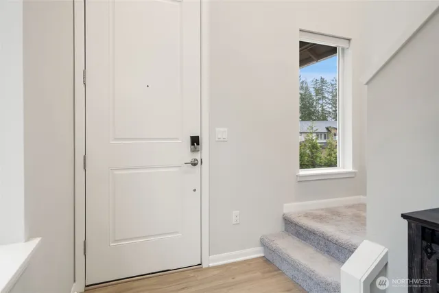 a living room with a bed and a window