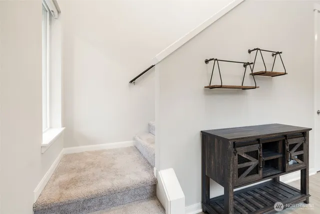 a spacious bedroom with a bed and a window