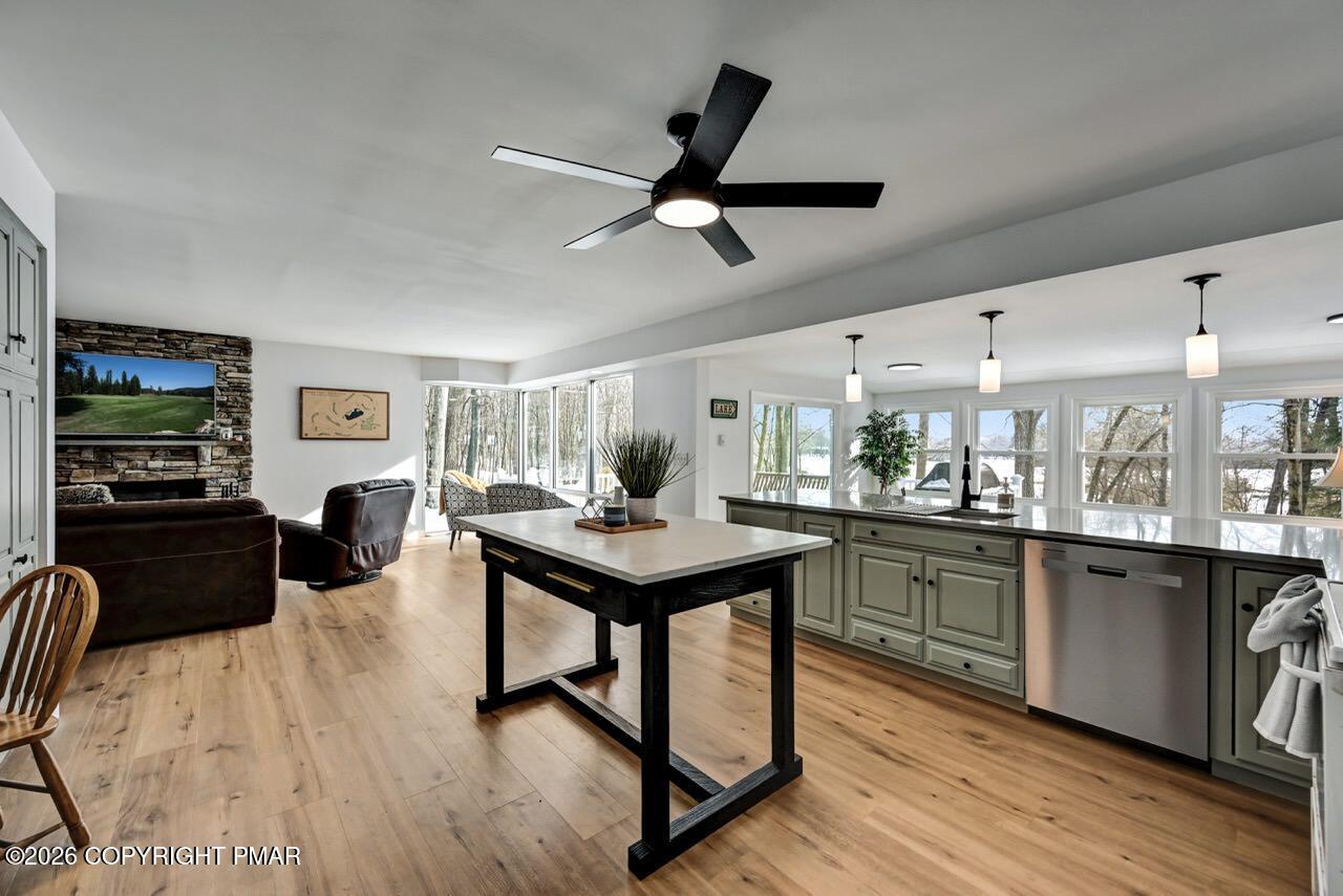 116 Spyglass Hill Road Tobyhanna, PA 18466 - Photo 25 of 73 a kitchen with stainless steel appliances a table chairs refrigerator and wooden floor