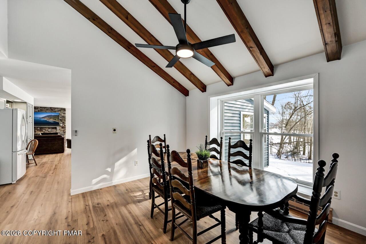 116 Spyglass Hill Road Tobyhanna, PA 18466 - Photo 28 of 73 a view of a dining room with furniture and wooden floor