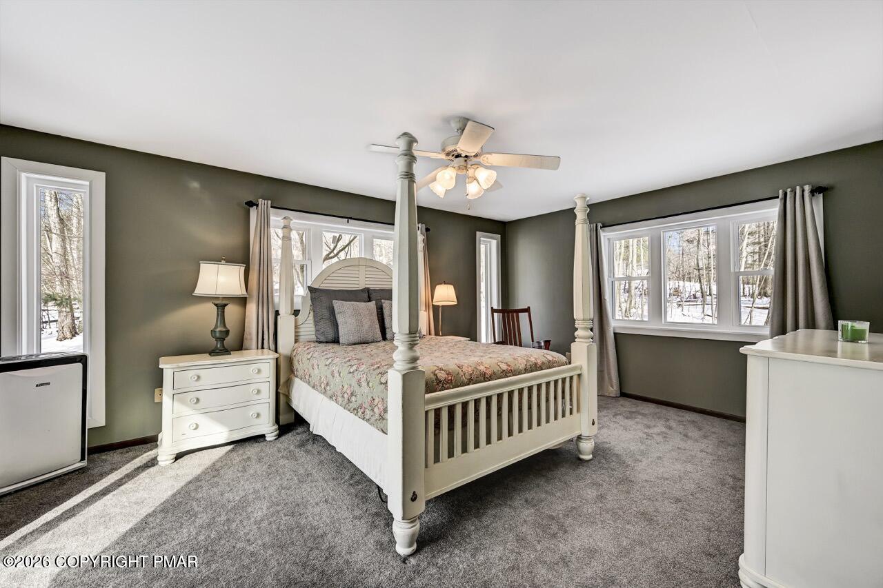 116 Spyglass Hill Road Tobyhanna, PA 18466 - Photo 31 of 73 a bedroom with a bed next to a large window with the outer view