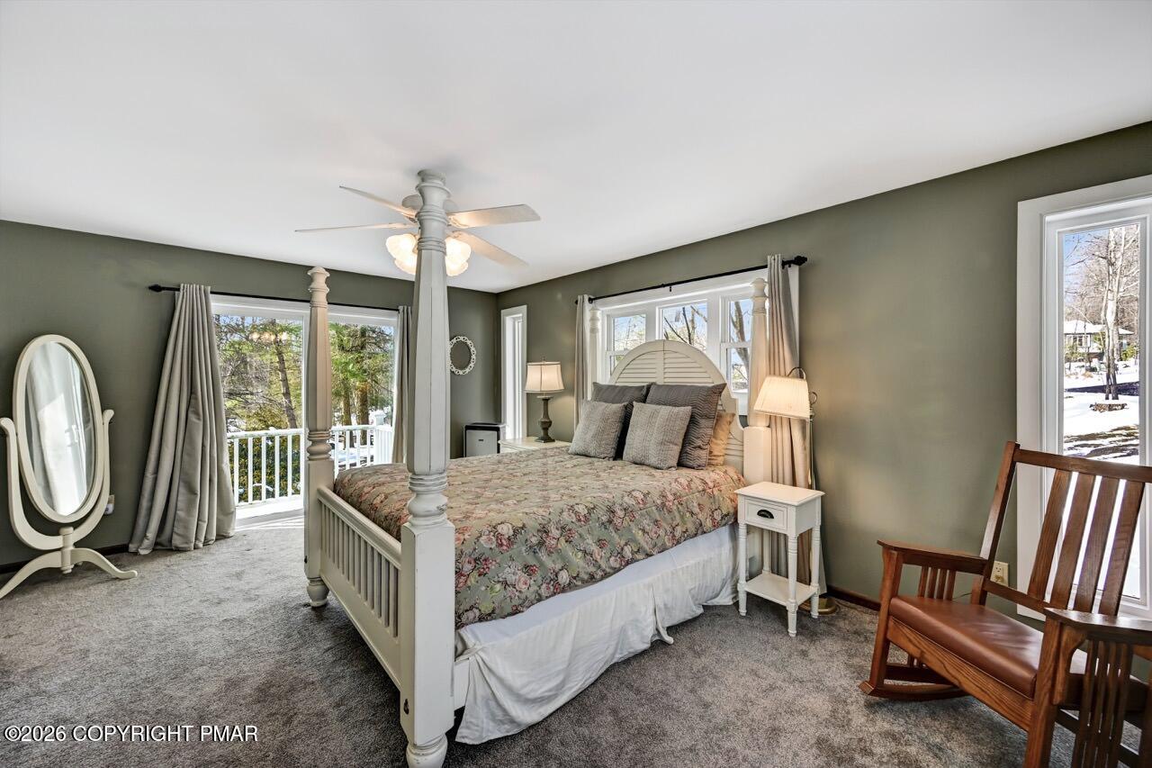 116 Spyglass Hill Road Tobyhanna, PA 18466 - Photo 32 of 73 a bed room with a bed and a chandelier