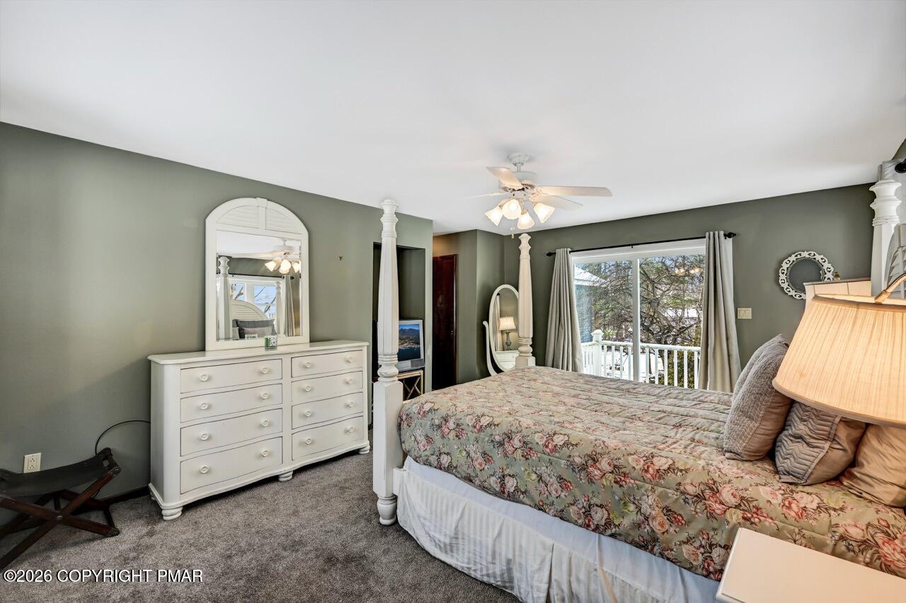 116 Spyglass Hill Road Tobyhanna, PA 18466 - Photo 33 of 73 a bedroom with a large bed and a chandelier