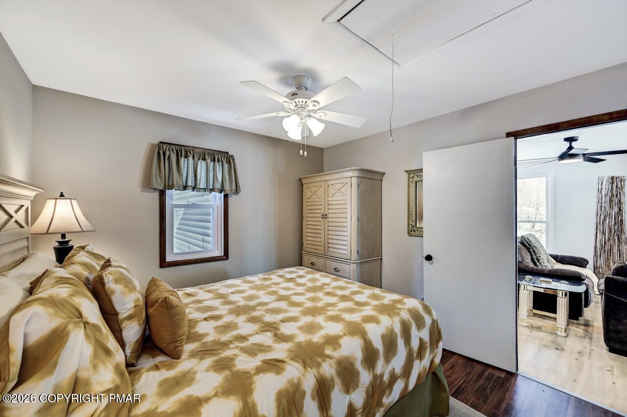 116 Spyglass Hill Road Tobyhanna, PA 18466 - Photo 38 of 73 a bedroom with a bed and a chandelier