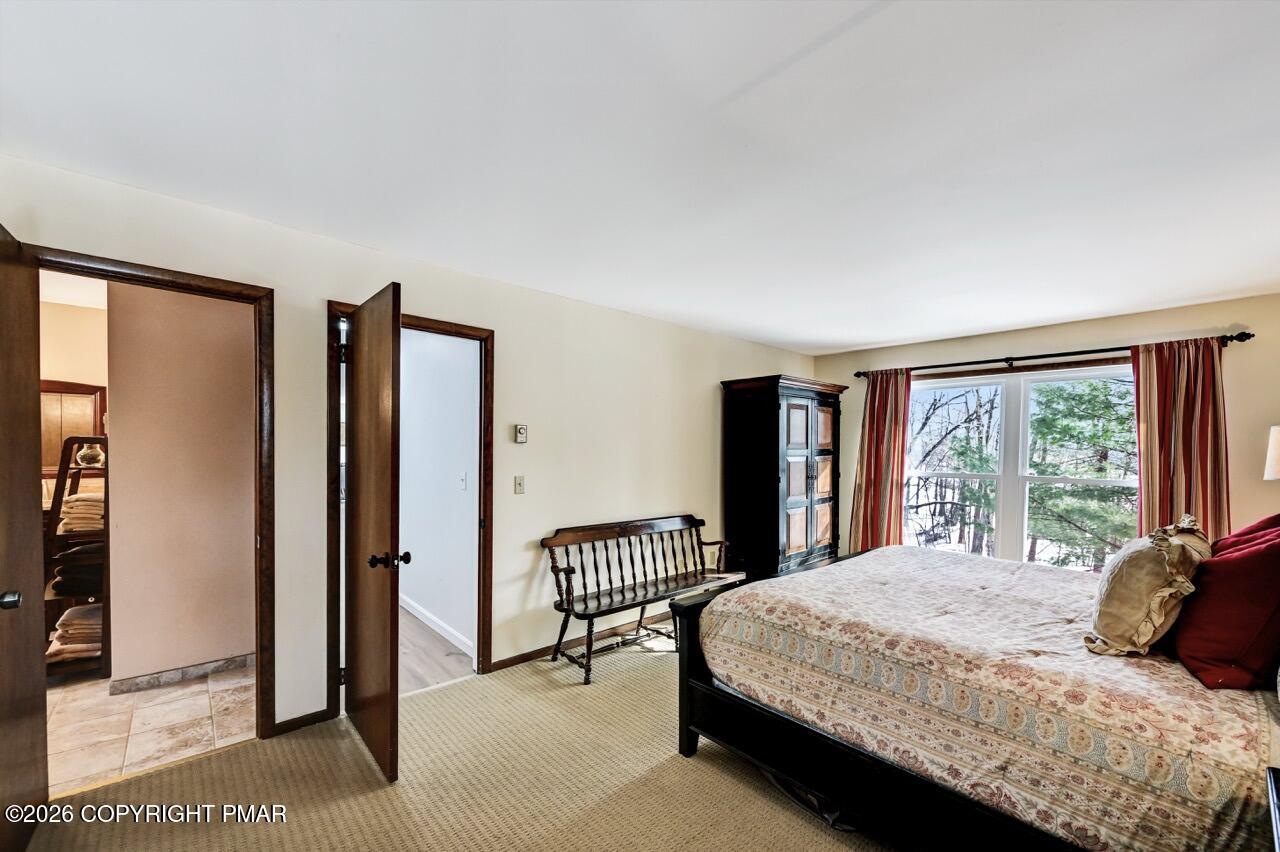 116 Spyglass Hill Road Tobyhanna, PA 18466 - Photo 45 of 73 a bedroom with a bed and a large window