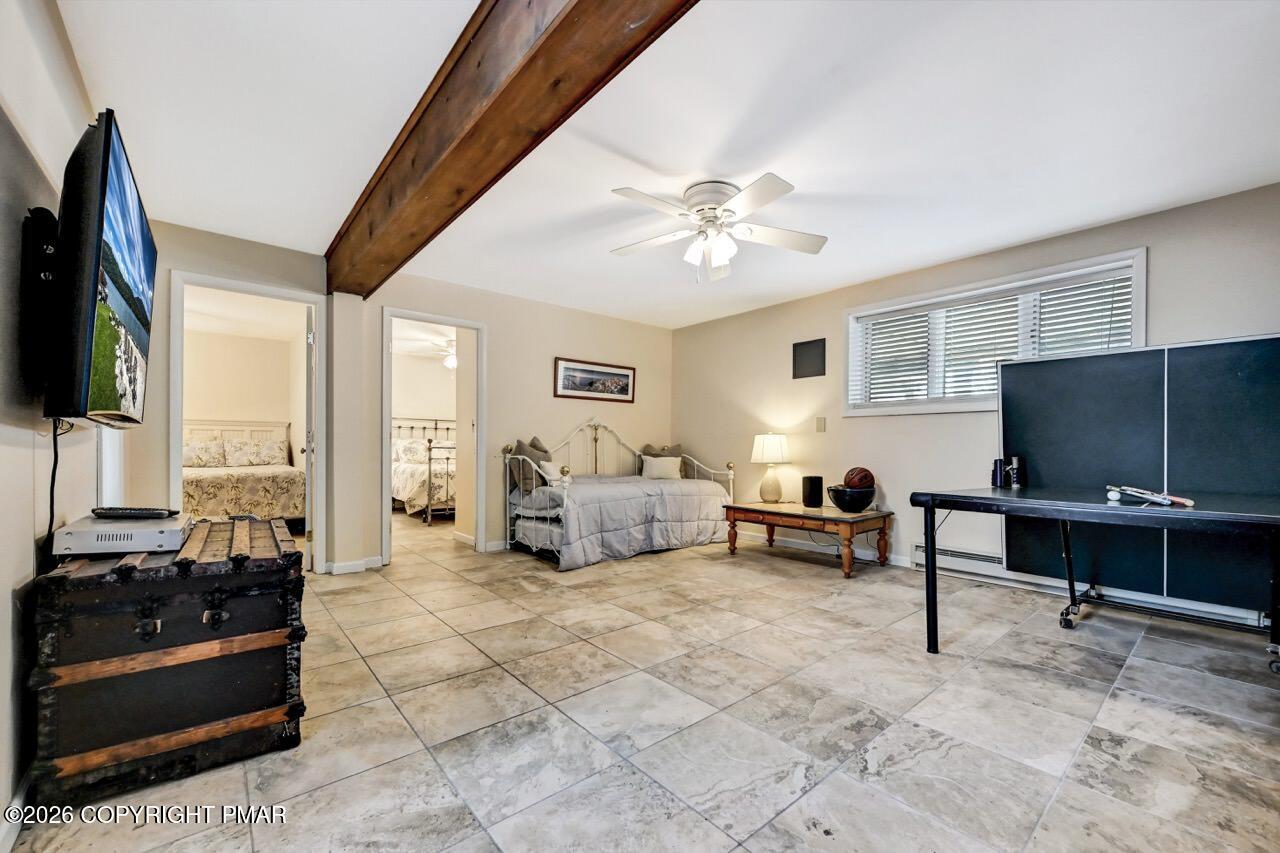 116 Spyglass Hill Road Tobyhanna, PA 18466 - Photo 47 of 73 a living room with furniture a flat screen tv and a large window