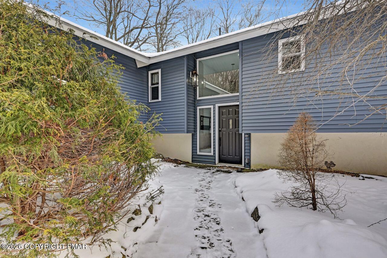 116 Spyglass Hill Road Tobyhanna, PA 18466 - Photo 6 of 73 a view of a house with a yard and garage