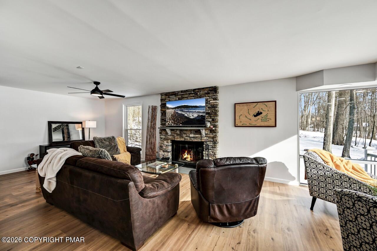 116 Spyglass Hill Road Tobyhanna, PA 18466 - Photo 9 of 73 a living room with furniture and a fireplace