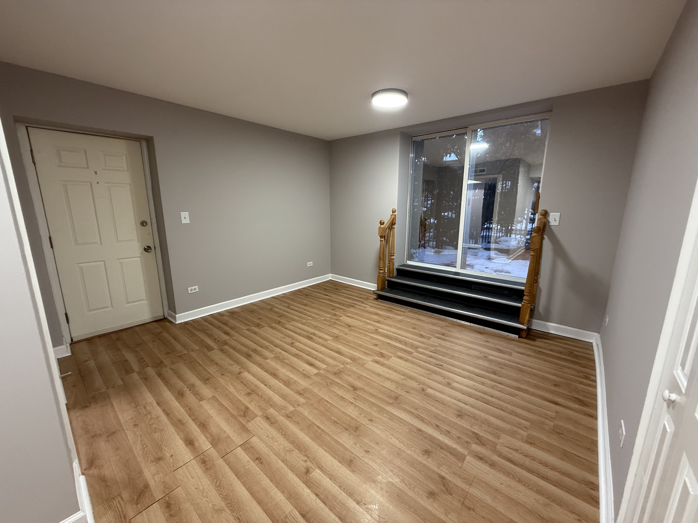 6954 North Greenview Avenue, Unit 100 Chicago, IL 60626 - Photo 2 of 7 a view of a room with wooden floor