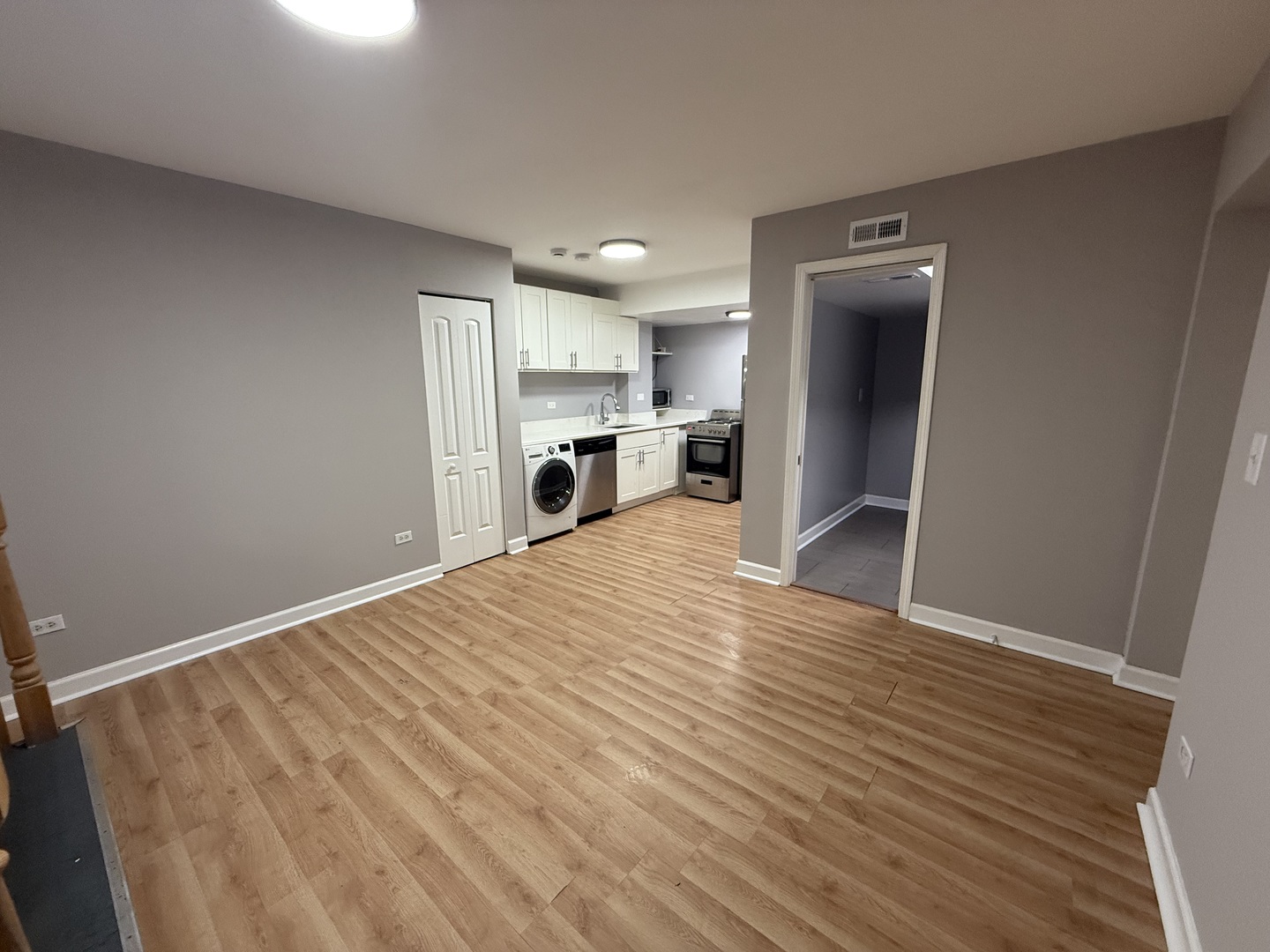 6954 North Greenview Avenue, Unit 100 Chicago, IL 60626 - Photo 4 of 7 a view of a kitchen with a sink and a refrigerator