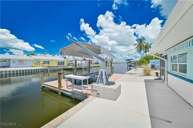 an aerial view of a house with swimming pool outdoor seating and yard
