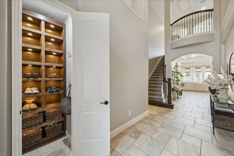 a view of a hallway with seating area