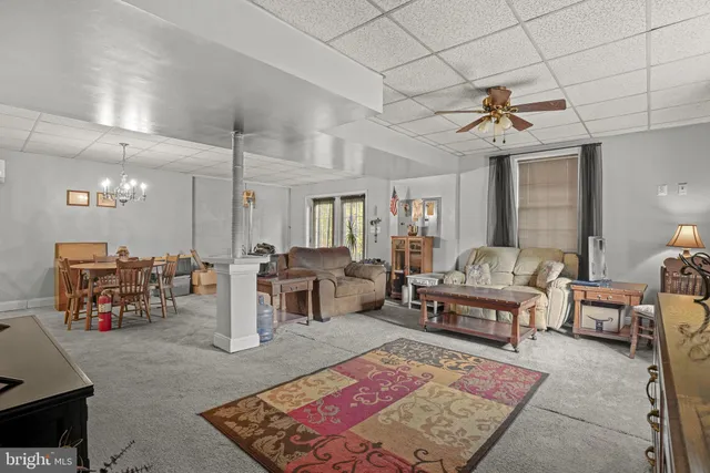 a view of a livingroom with furniture and a window
