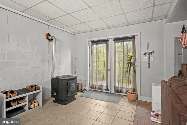 a view of a house with a swimming pool and a yard