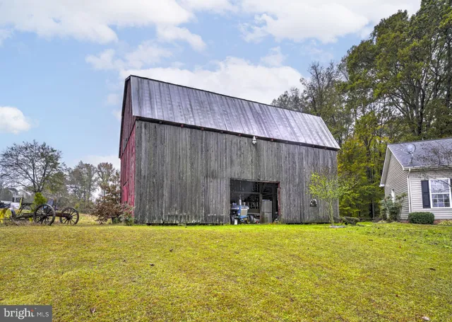 a view of a swimming pool with an outdoor space and seating area