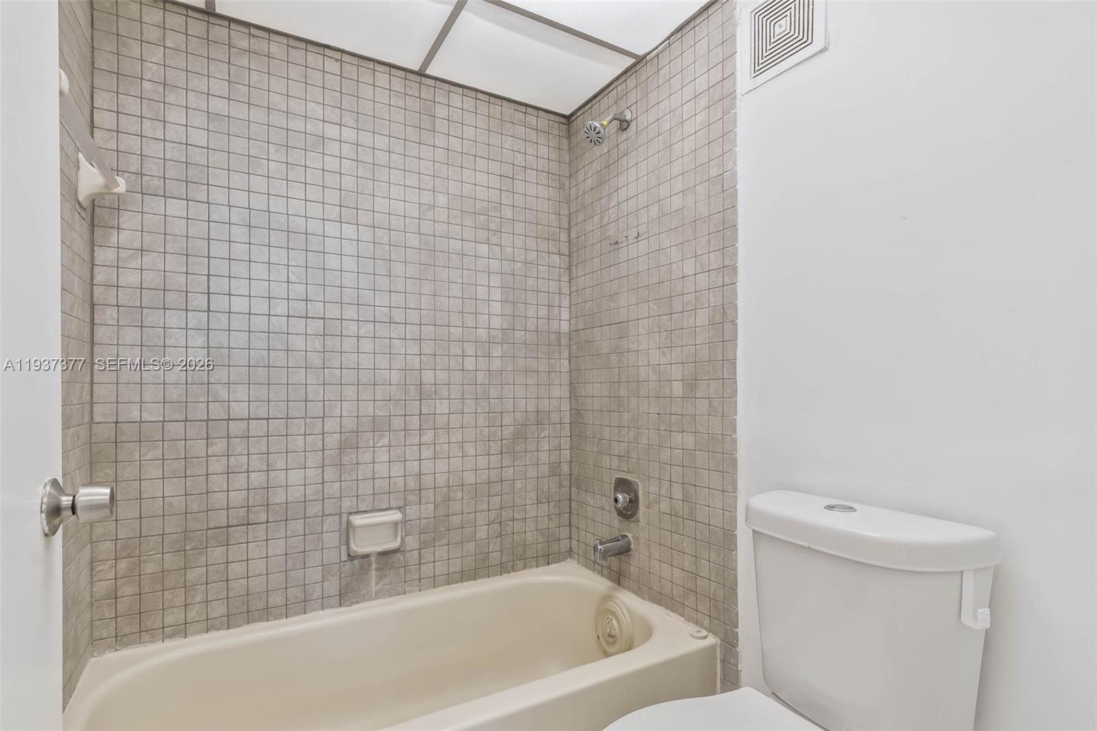 10985 Southwest 107th Street, Unit 310 Miami, FL 33176 - Photo 13 of 30 a bathroom with a bathtub and a toilet