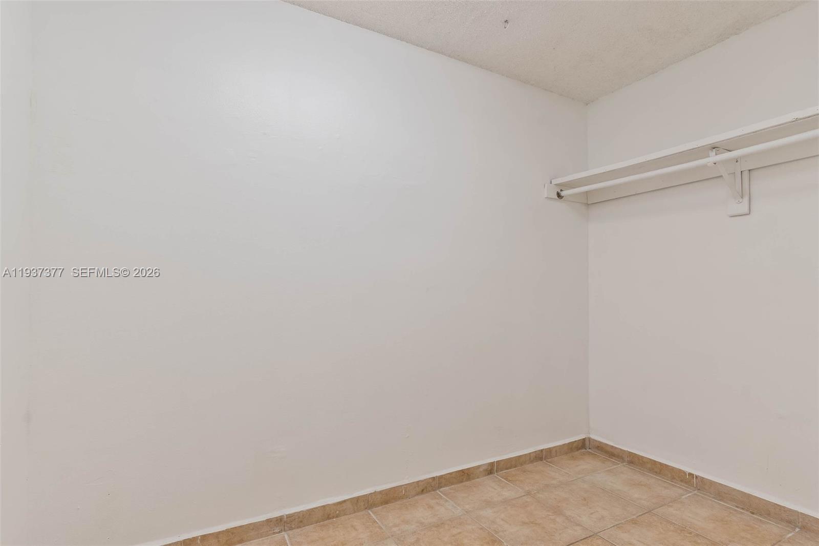 10985 Southwest 107th Street, Unit 310 Miami, FL 33176 - Photo 14 of 30 a view of small space with empty racks