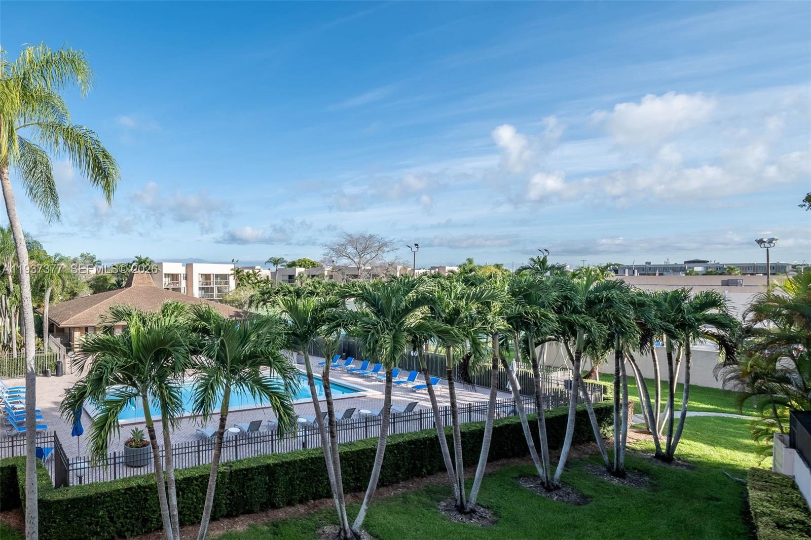 10985 Southwest 107th Street, Unit 310 Miami, FL 33176 - Photo 16 of 30 a view of a yard with a palm tree