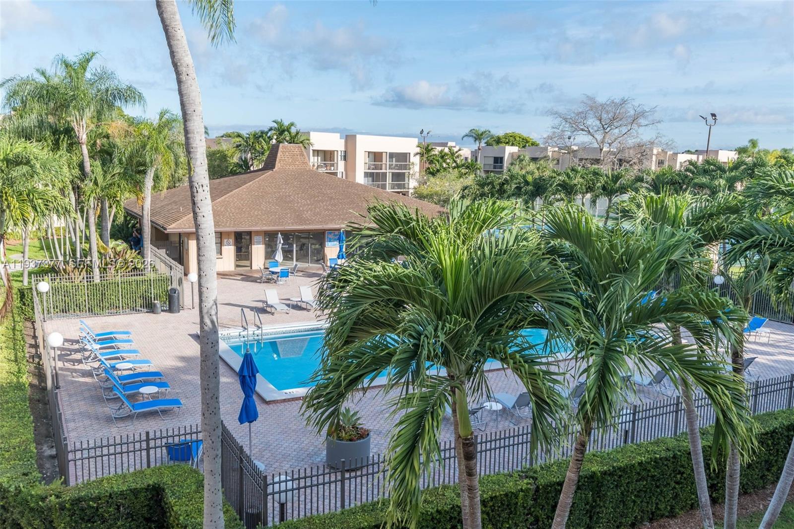 10985 Southwest 107th Street, Unit 310 Miami, FL 33176 - Photo 18 of 30 a view of a house with a yard and potted plants