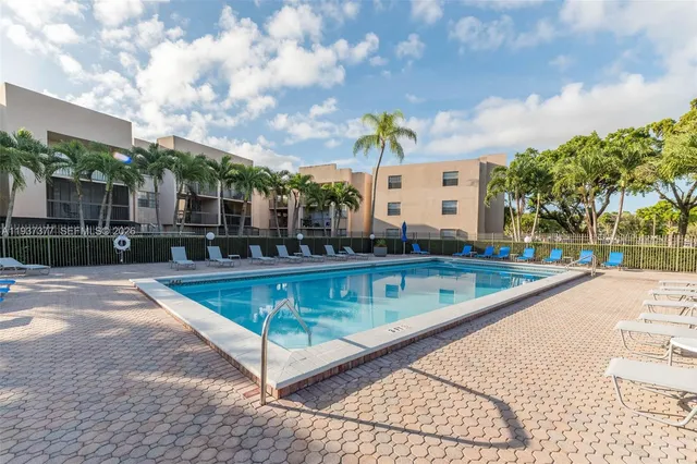 a view of a swimming pool with a patio
