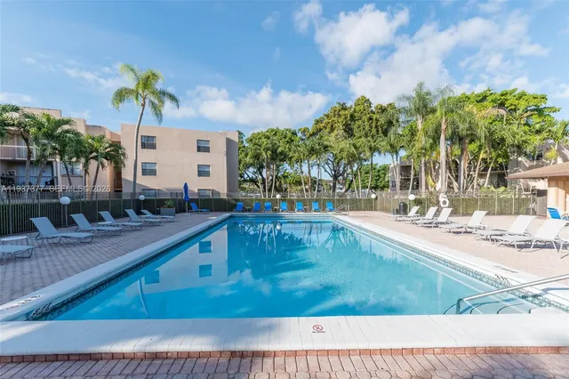a view of a swimming pool with a patio