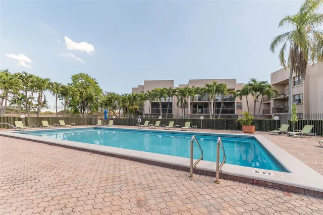a view of a swimming pool with a lounge chairs