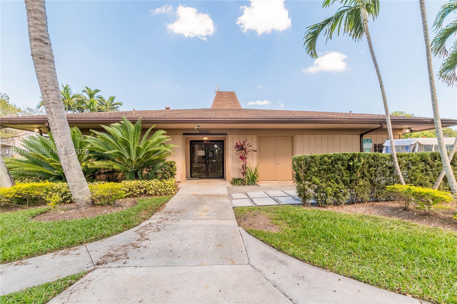 10985 Southwest 107th Street, Unit 310 Miami, FL 33176 - Photo 26 of 30 a view of a house with a garden