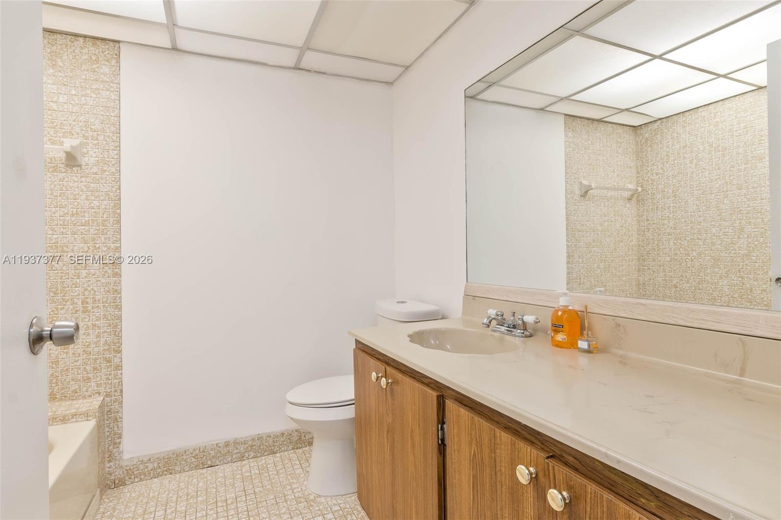 10985 Southwest 107th Street, Unit 310 Miami, FL 33176 - Photo 7 of 30 a bathroom with a sink a toilet and shower