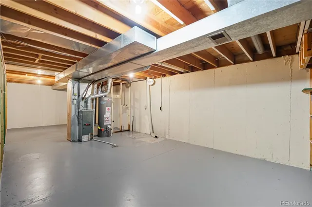 a view of a house with a yard and tree s