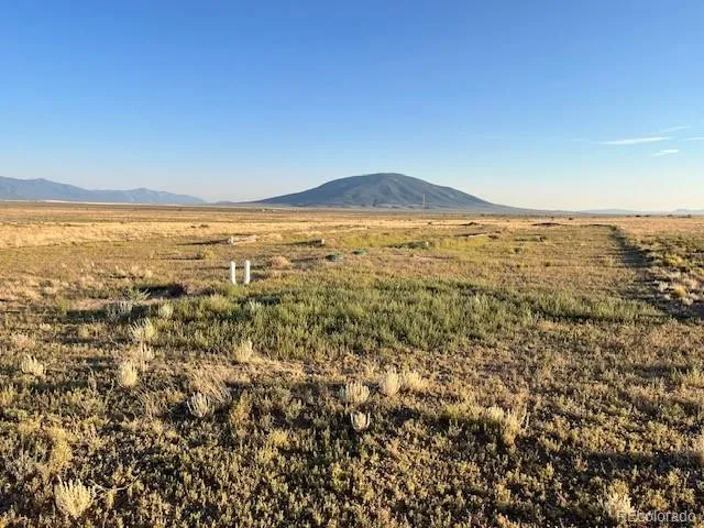 an aerial view of residential houses with ocean view
