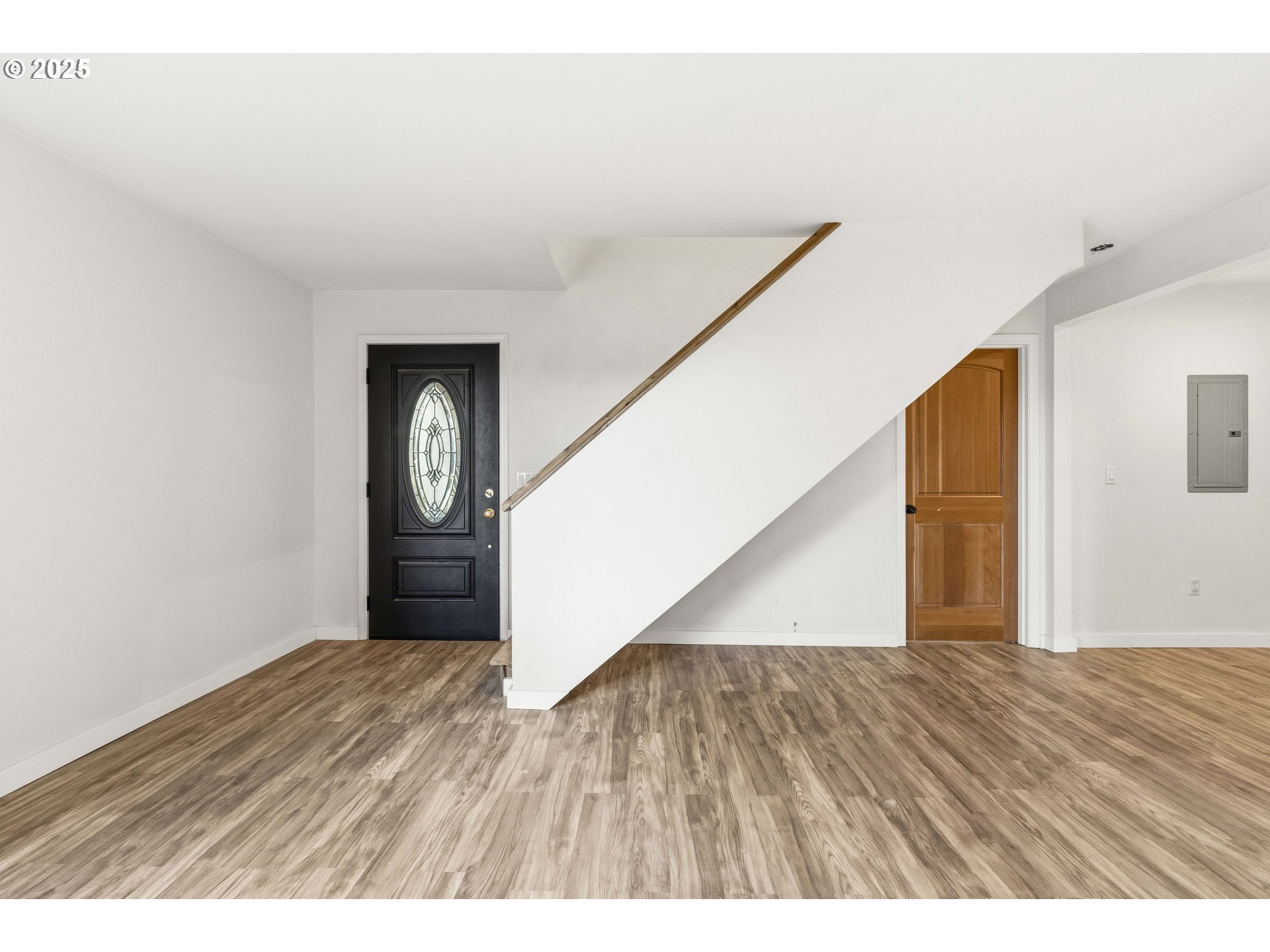 62356 Olive Barber Road Coos Bay, OR 97420 - Photo 16 of 34 a view of an empty room with wooden floor and a window
