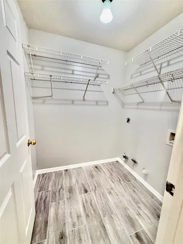 a view of a room with racks on the wall