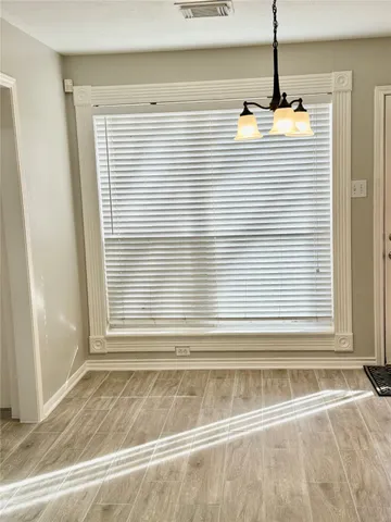 a view of a room that has a window