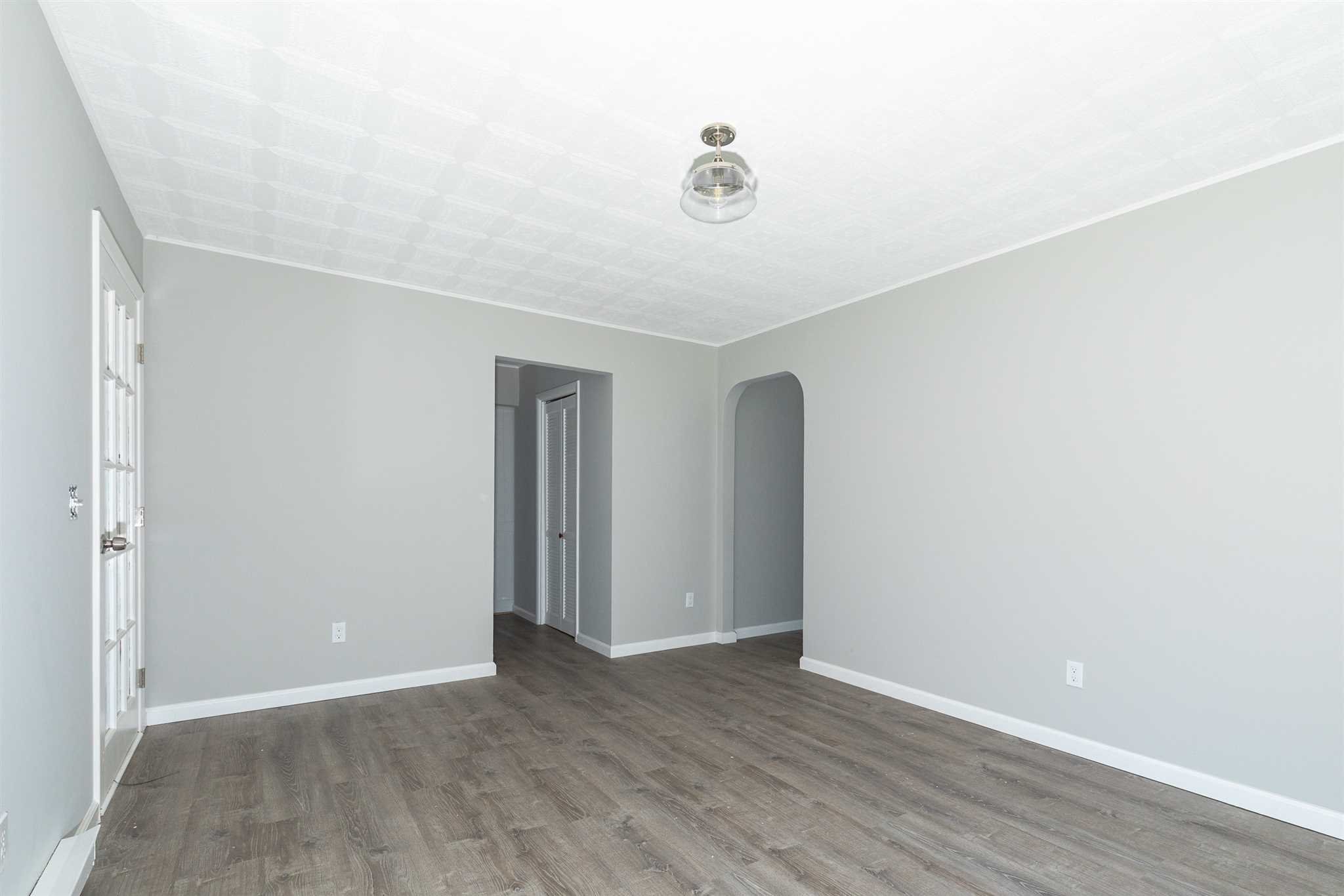 29 Milano Drive LaGrange, NY 12603 - Photo 12 of 21 an empty room with wooden floor and windows