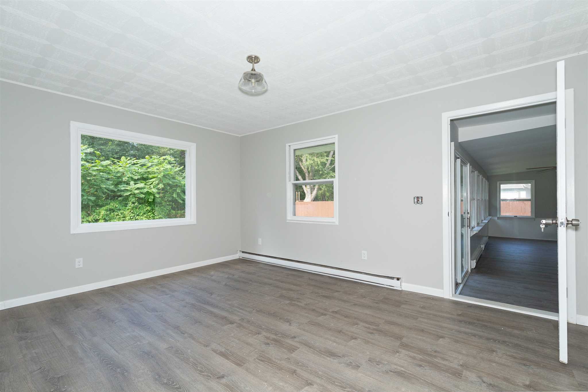 29 Milano Drive LaGrange, NY 12603 - Photo 13 of 21 a view of an empty room with a window and wooden floor