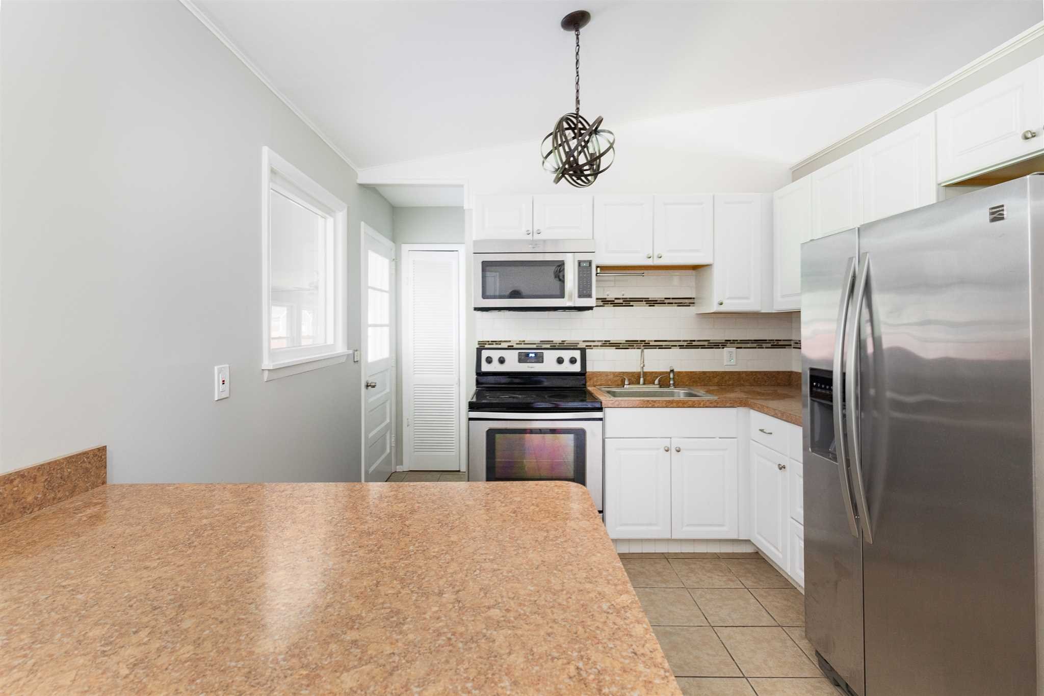 29 Milano Drive LaGrange, NY 12603 - Photo 6 of 21 a kitchen with stainless steel appliances a refrigerator sink and microwave