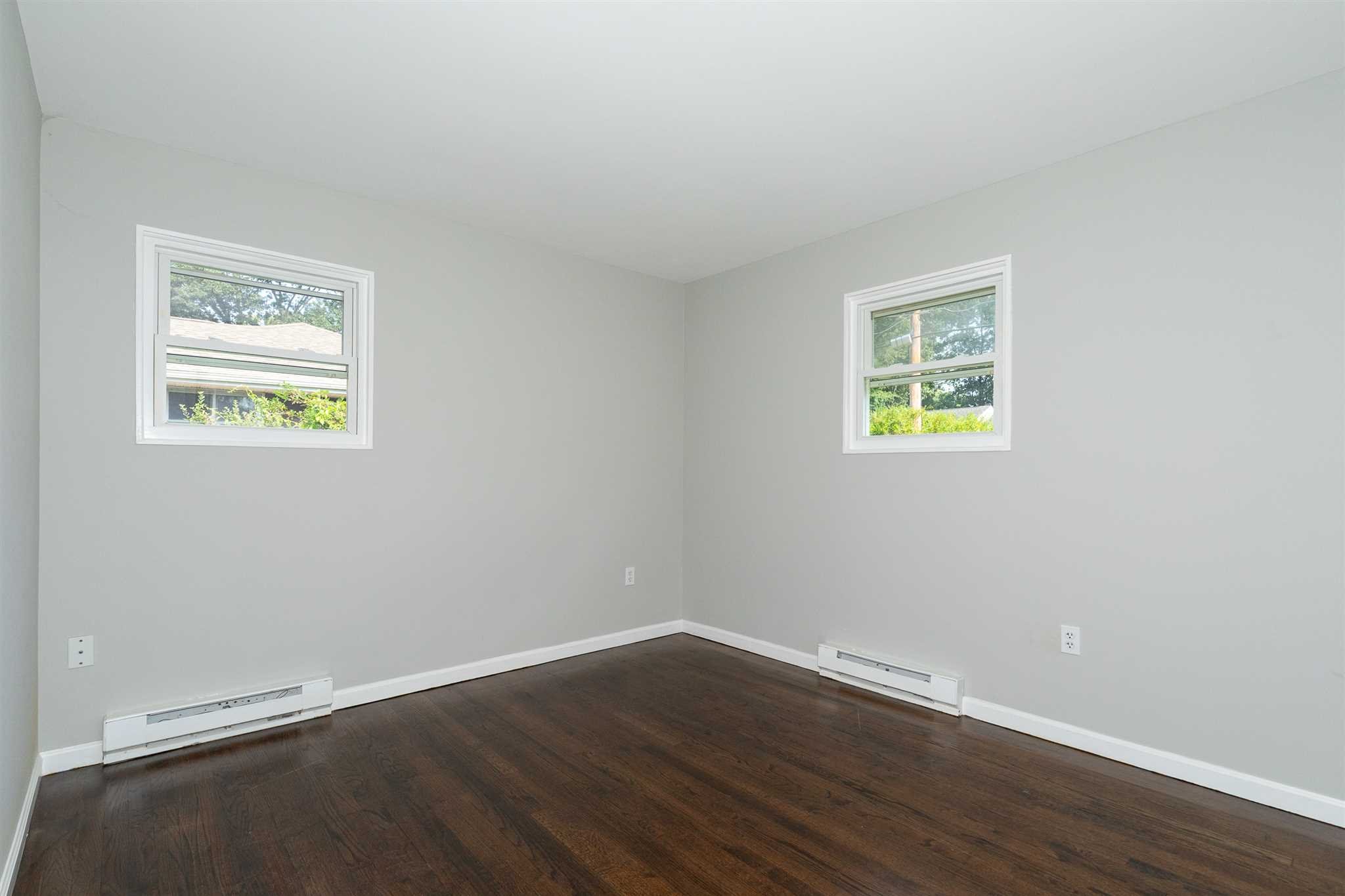 29 Milano Drive LaGrange, NY 12603 - Photo 8 of 21 a view of an empty room with wooden floor and a window