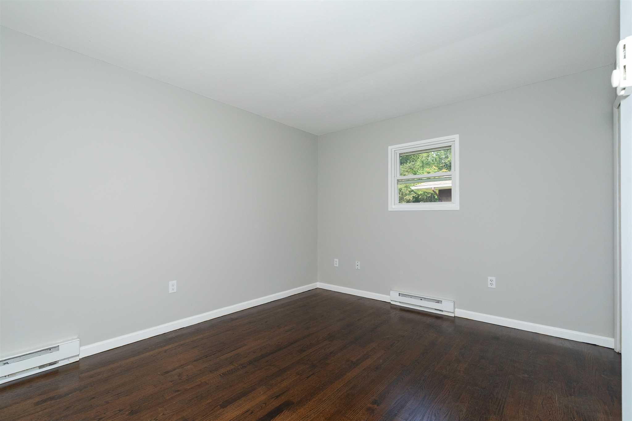 29 Milano Drive LaGrange, NY 12603 - Photo 9 of 21 a view of an empty room with wooden floor and a window